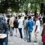 Migrants queuing in Como
